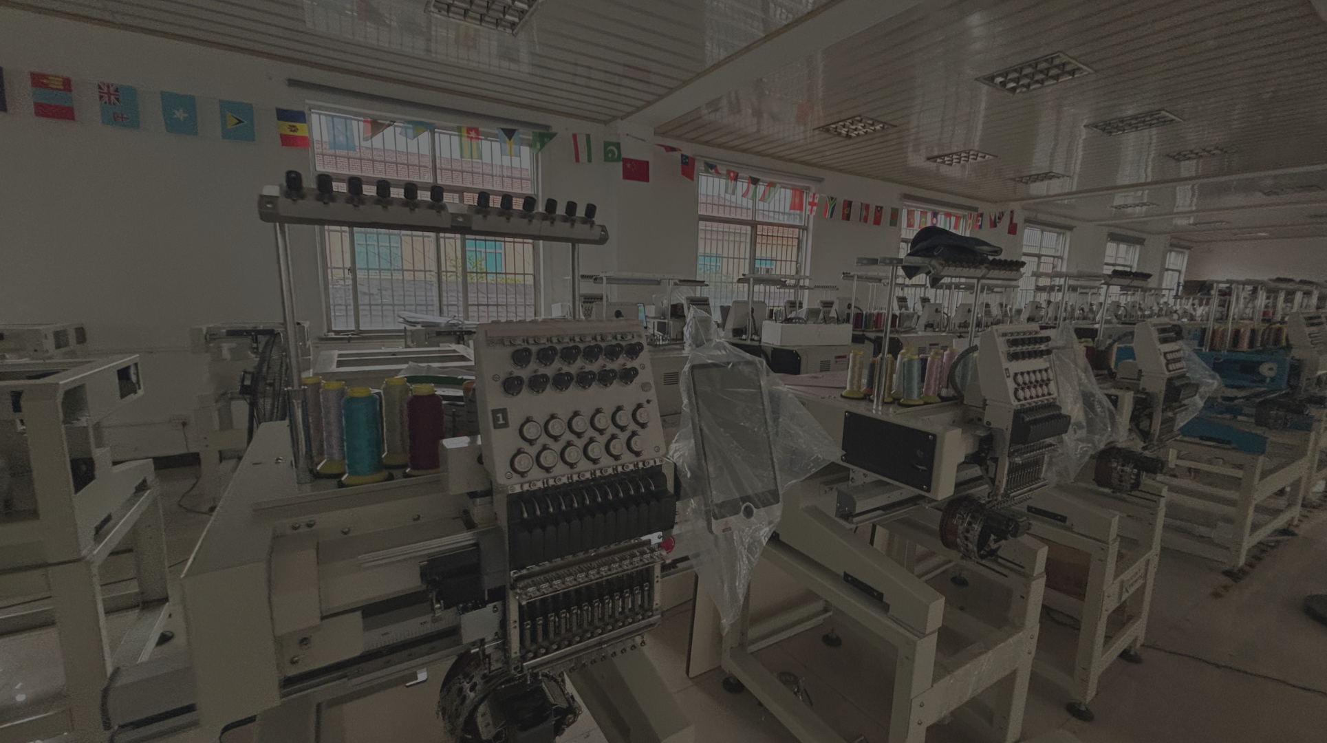 Embroidery machines used for custom cap production by Stitch Launch